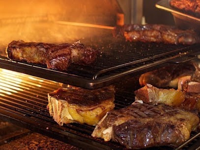 Restaurante asador que se especializa en butifarra y carnes a la brasa en Barcelona.          